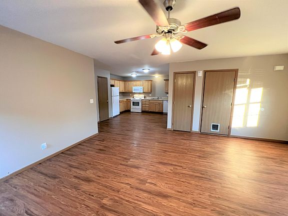 LR OPENS INTO KITCHEN...LOTS OF LIGHT AND SPACE. IN PHOTO ONE DOOR IS FOR HALL CLOSET AND THE OTHER GOES TO THE GARAGE