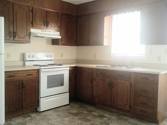 Kitchen w/ refinished cabinets, new stove, refrigerator and flooring