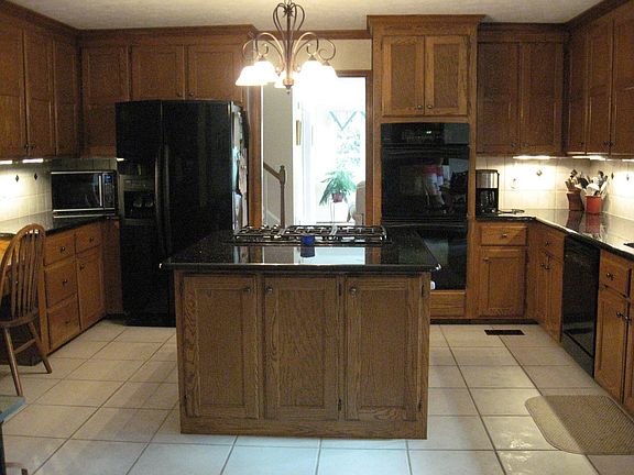 Amazing kitchen with black granite countertops.