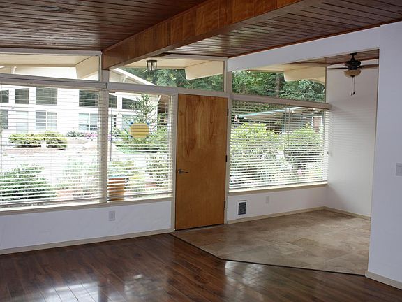 Entrance Interior. Large, double pane windows; view from living room