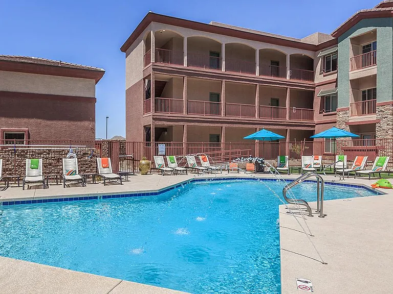 Poolside view with lounge chairs