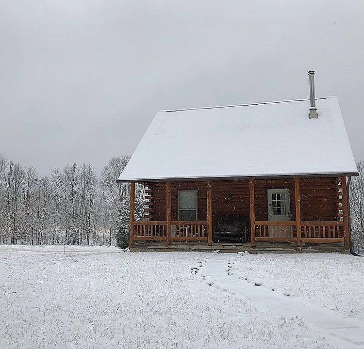 Cabin covered with snow