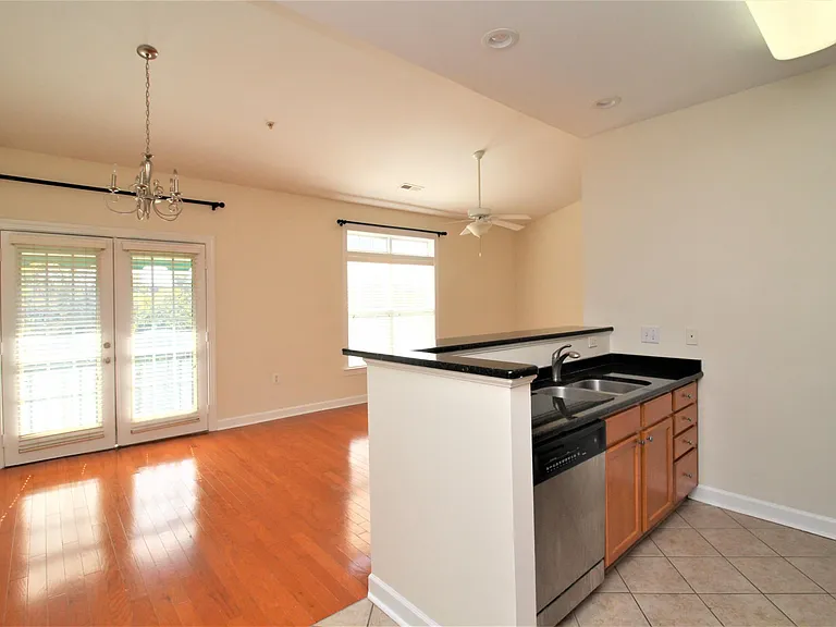 Alternate view of dining area and kitchen breakfast bar