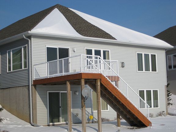 Large deck with stairs to back yard