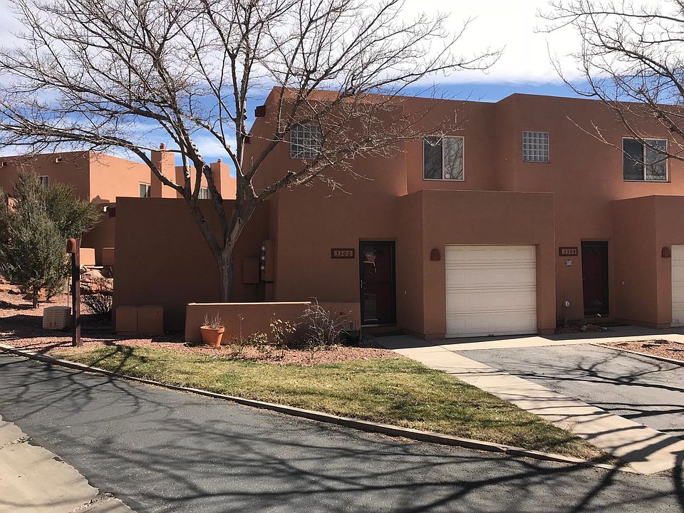 Front of condo. Garage and parking space in front.
