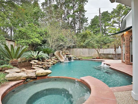 Unbelievable back yard oasis with pool, spa and beautiful landscaping.