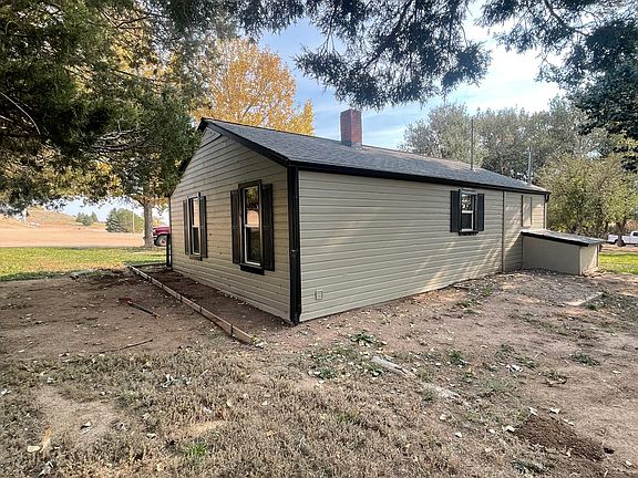 back of house with view of soon-to-be concrete porch