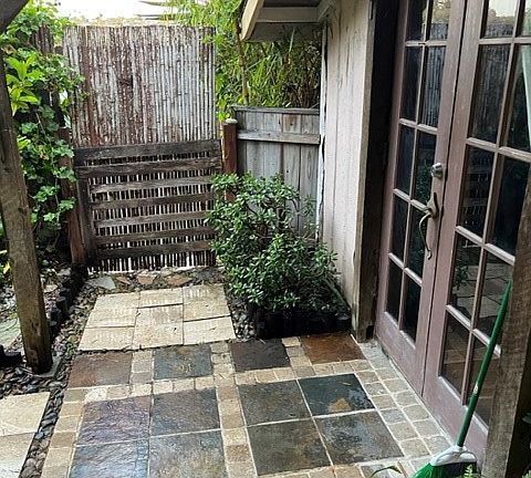 Front gate, front door, and patio area.