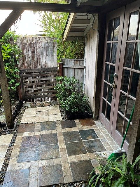 Front gate, front door, and patio area.