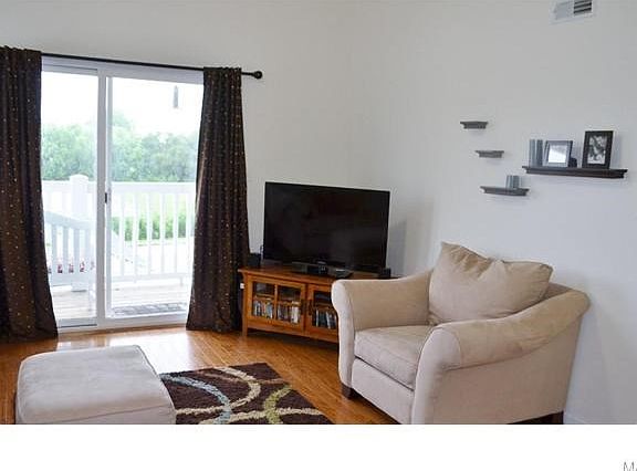 Sliding glass doors provide easy access from the great room to the private porch.