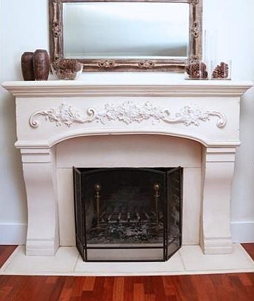 Living room with Brazilian cherry floor, cast stone mantle, plas