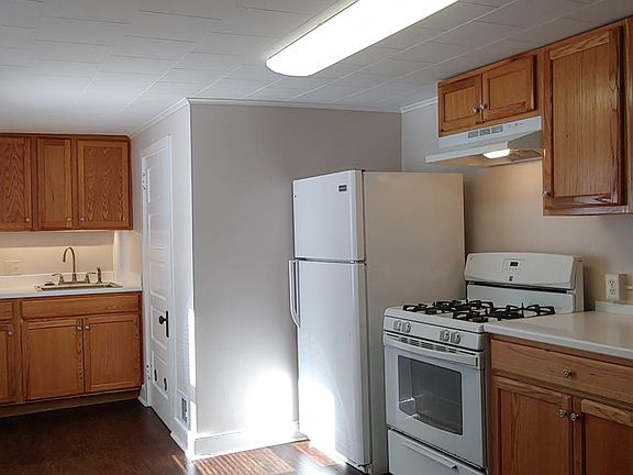 Newly remodeled Kitchen features new vinyl flooring, cabinets and counters