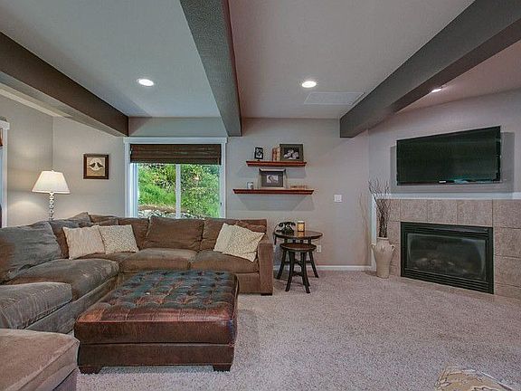 Spacious living room with gas fireplace.