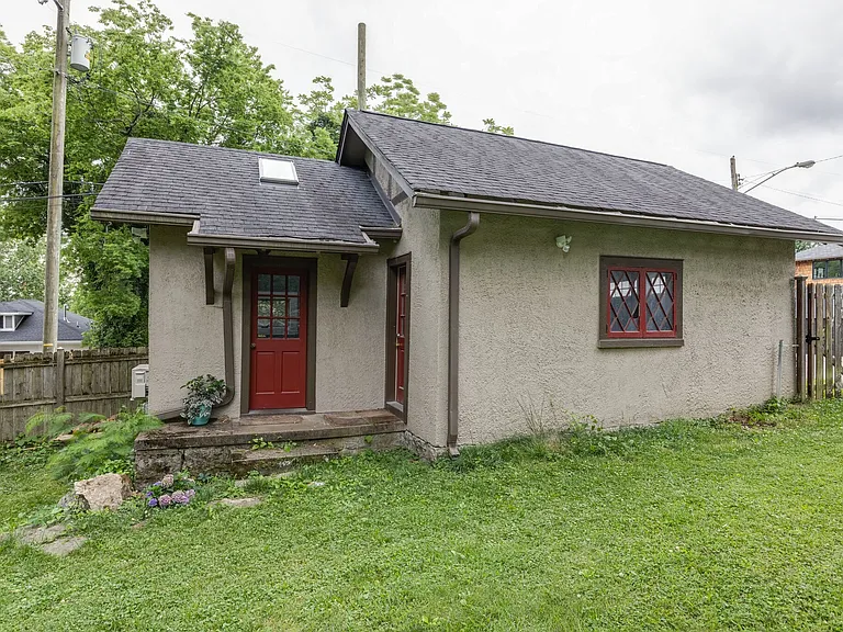Detached office or studio space with private entry and fenced yard access.