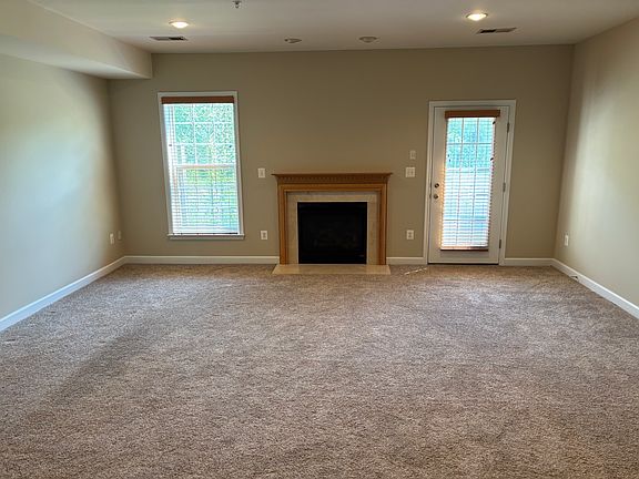 First floor den area with gas fireplace.