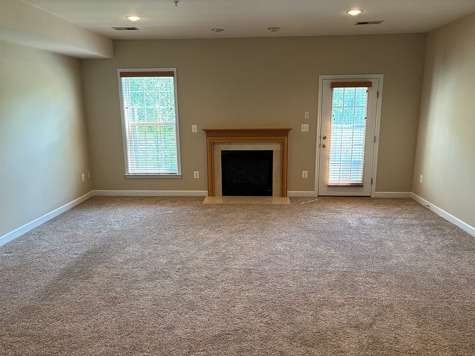 First floor den area with gas fireplace.