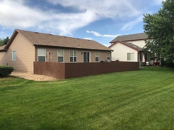 Fenced backyard with large greenbelt behind