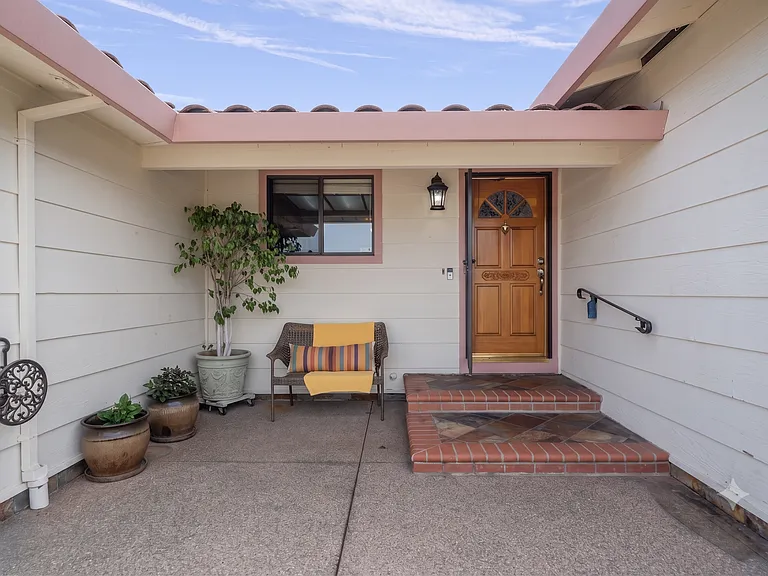Covered courtyard entry with seating nook