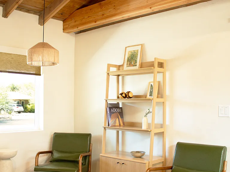Cozy seating nook with vaulted ceiling and exposed beams.