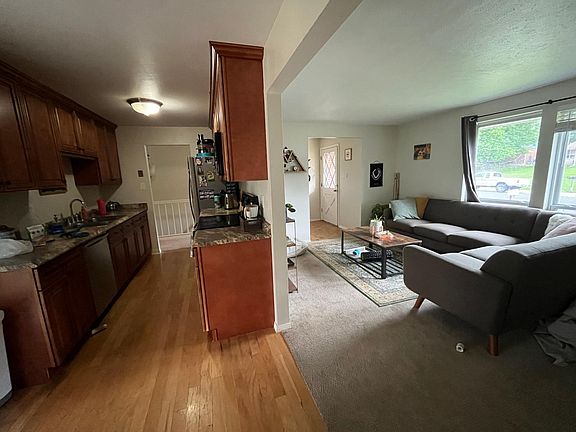 View from dining area into the kitchen and the living room.