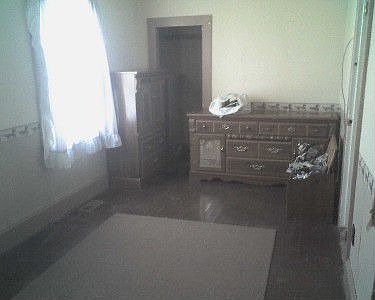Bedroom with wood floors