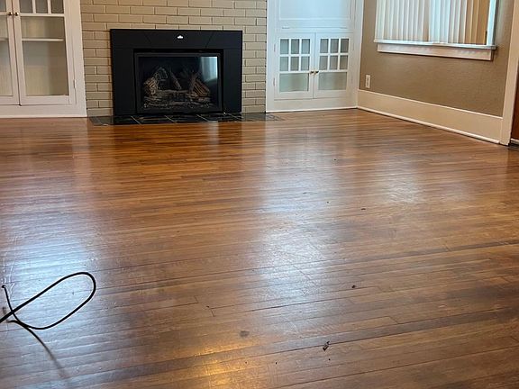 Fireplace with built in cabinets and desk