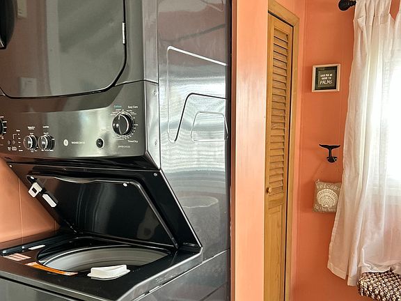 Washer dryer in bedroom , closet and dresser