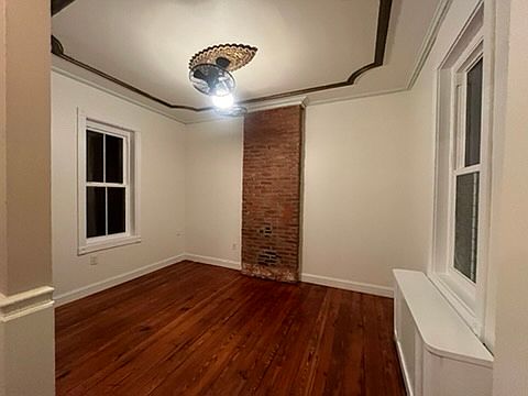 Living room exposed brick, random width hardwood floors