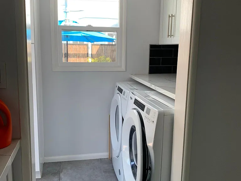 Laundry room with loads of storage