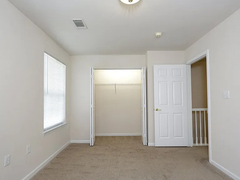 Large bedrooms with plush carpet makes home that much more comfortable