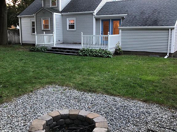 Backyard Fire pit with large deck to entertain