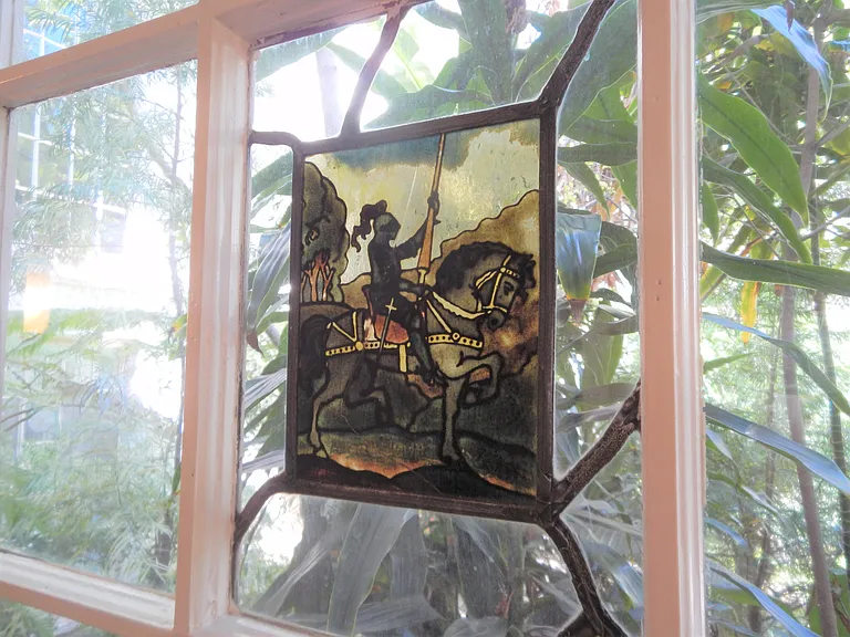 stained glass inset in leaded glass window