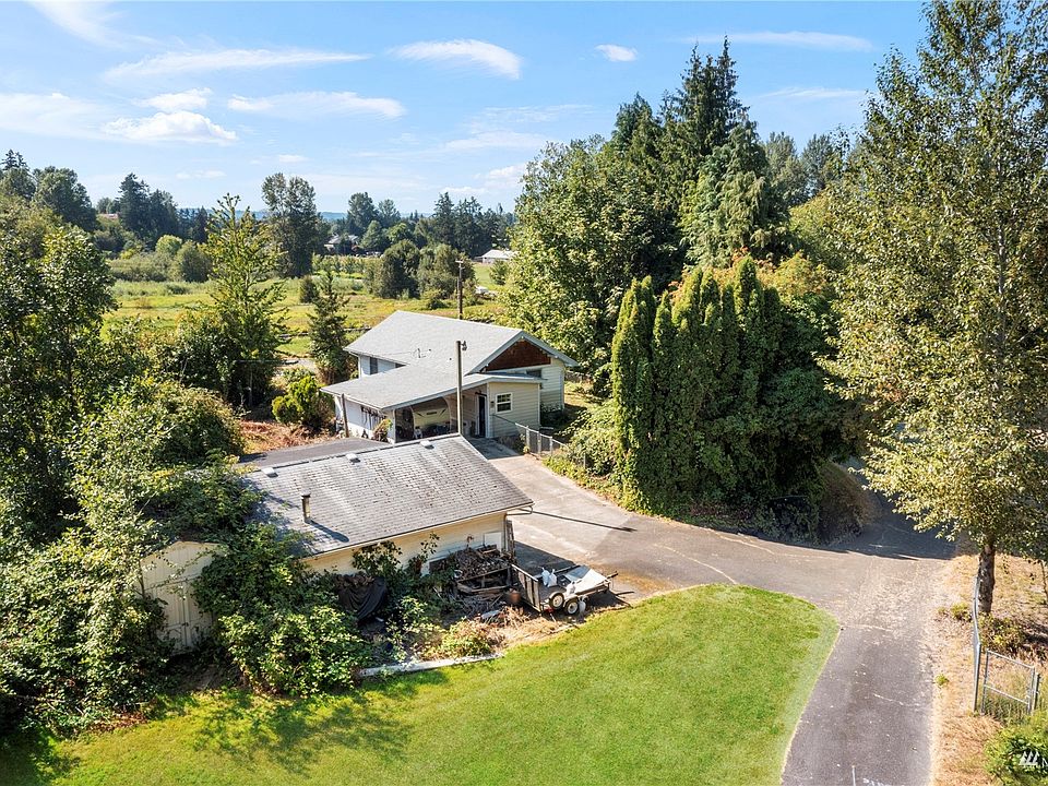 Check out the potential here with a cute craftsman home & detached 24x24 garage settled on an acre of property>