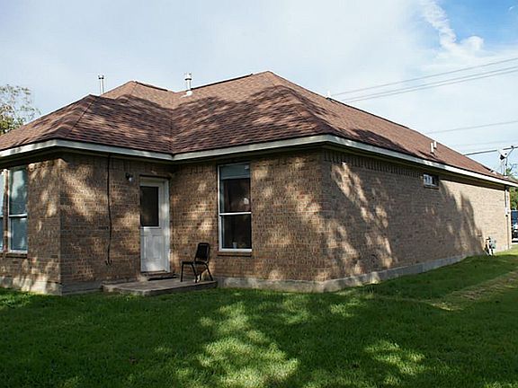 Back, left side of home.