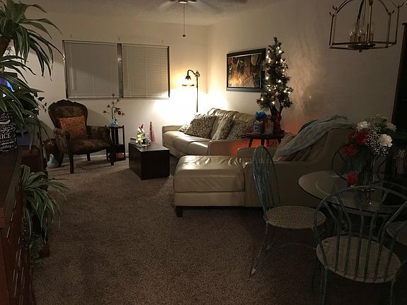 Open floor plan with dining room/living room. Slider to screened-in porch