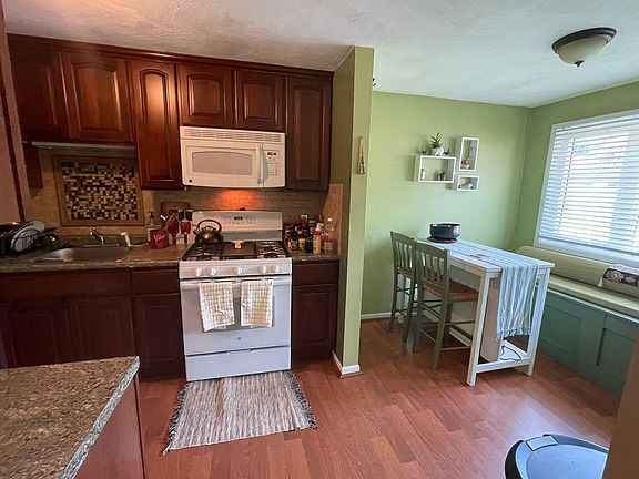 Kitchen with bench by the window. Perfect for converting into a breakfast nook.