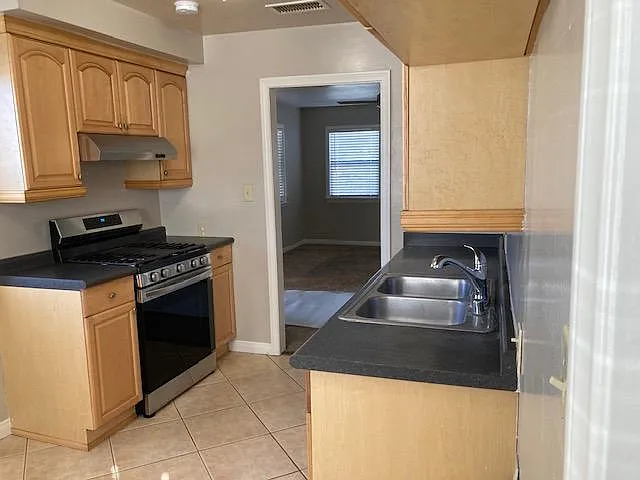 Range and D/W are one year old.
Generous cabinets ike new.
