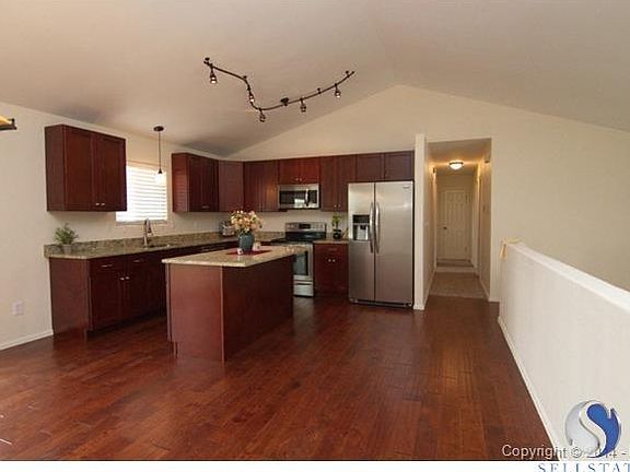 Updated kitchen. Birch hardwood flooring. Maple cabinetry. Grani