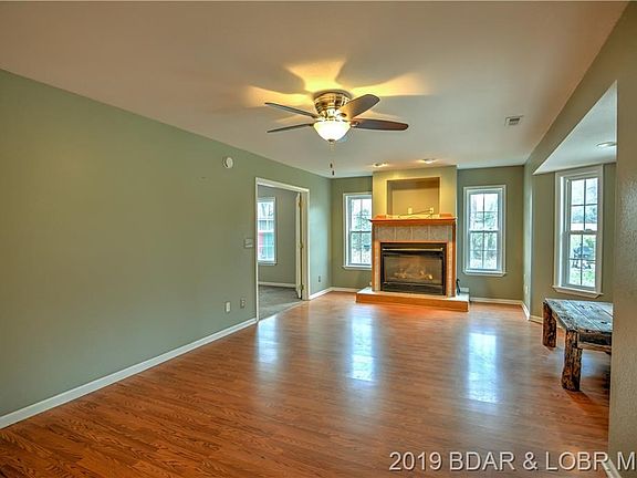 Large living room with a cozy fireplace.