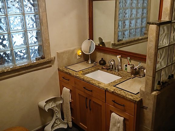 Stone, granite, slate, glass terracotta downstairs bath.