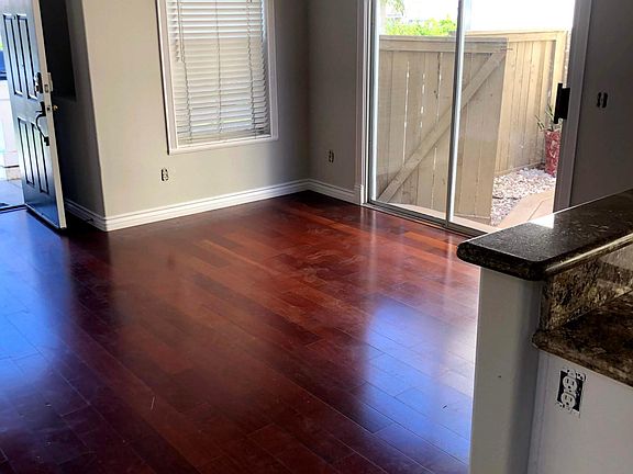 Dining area opens to Patio area with gas connection for grilling. Side yard has 3 mature lemon trees. Landscaping is taken care of my homeowner.