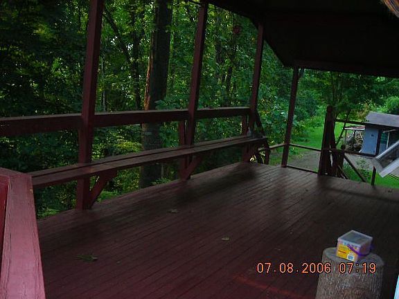 Front Deck with sitting bench across the deck.