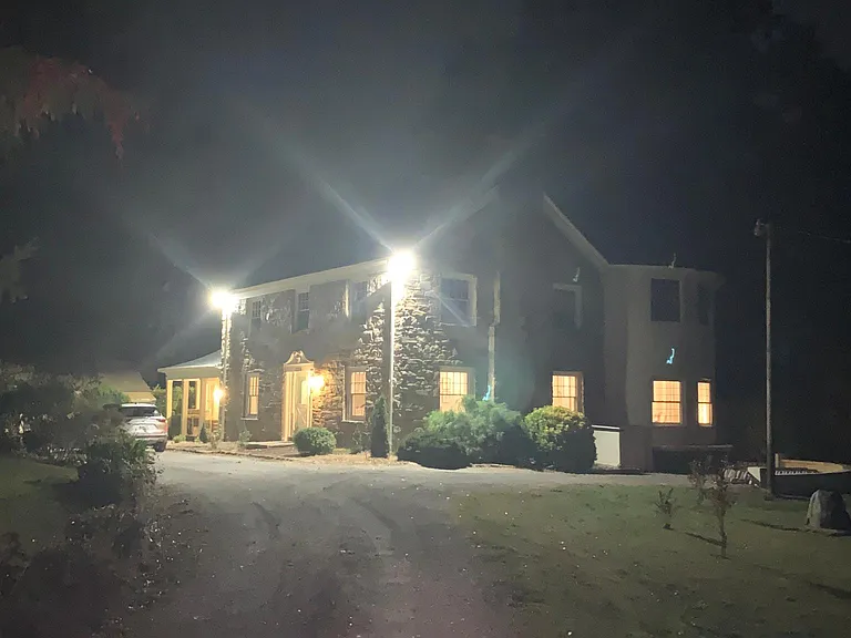 Exterior of main house with lights