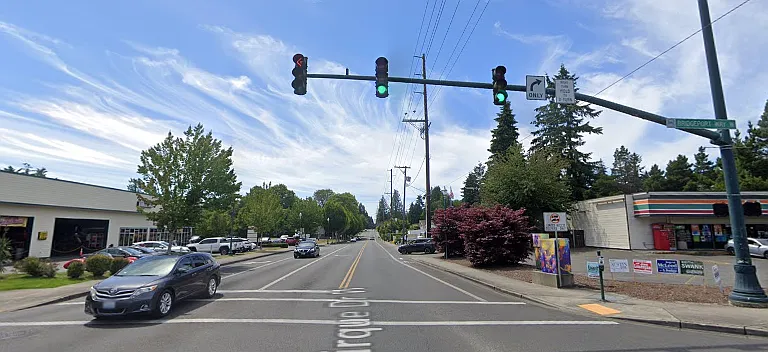 Between Bridgeport Way W. and Cirque Dr, Across 7/11, Behind Classic Coffee Shop
