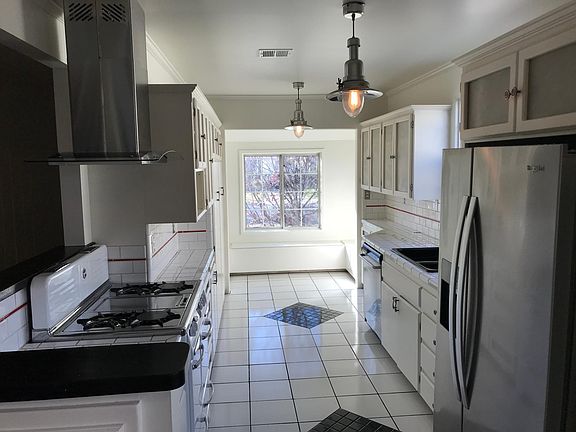 Bright Kitchen with stainless steel appliances and sunny Breakfast Nook.