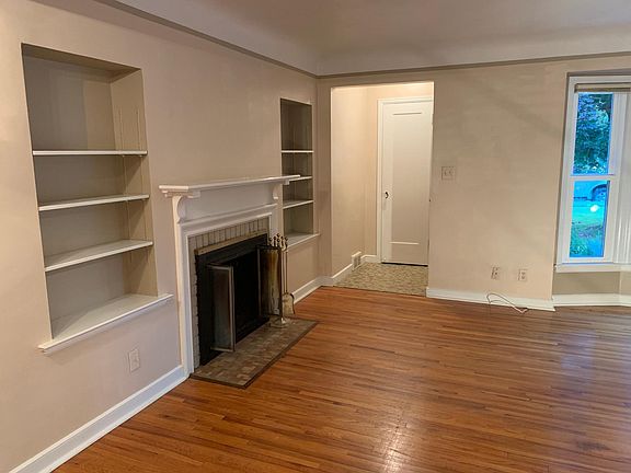 Front entry, living room and fireplace.