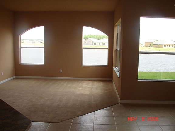 Here is another view of family room and tiled breakfast nook.  This looks towards the back of the house with a very large backyard and wonderful lake views.