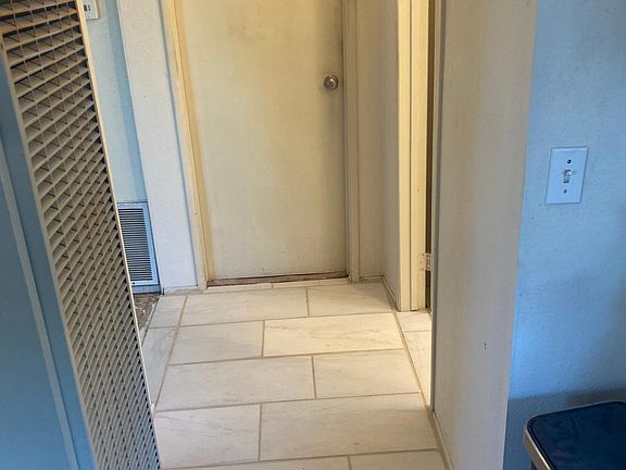 New Porcelain Tile Extends from Kitchen down hall to Bathroom