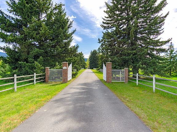 Singing birds welcome you along the verdant tree-lined drive
