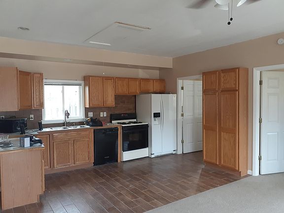 Custom solid wood cabinets, dishwasher, microwave and side-by side fridge filtered ice and water